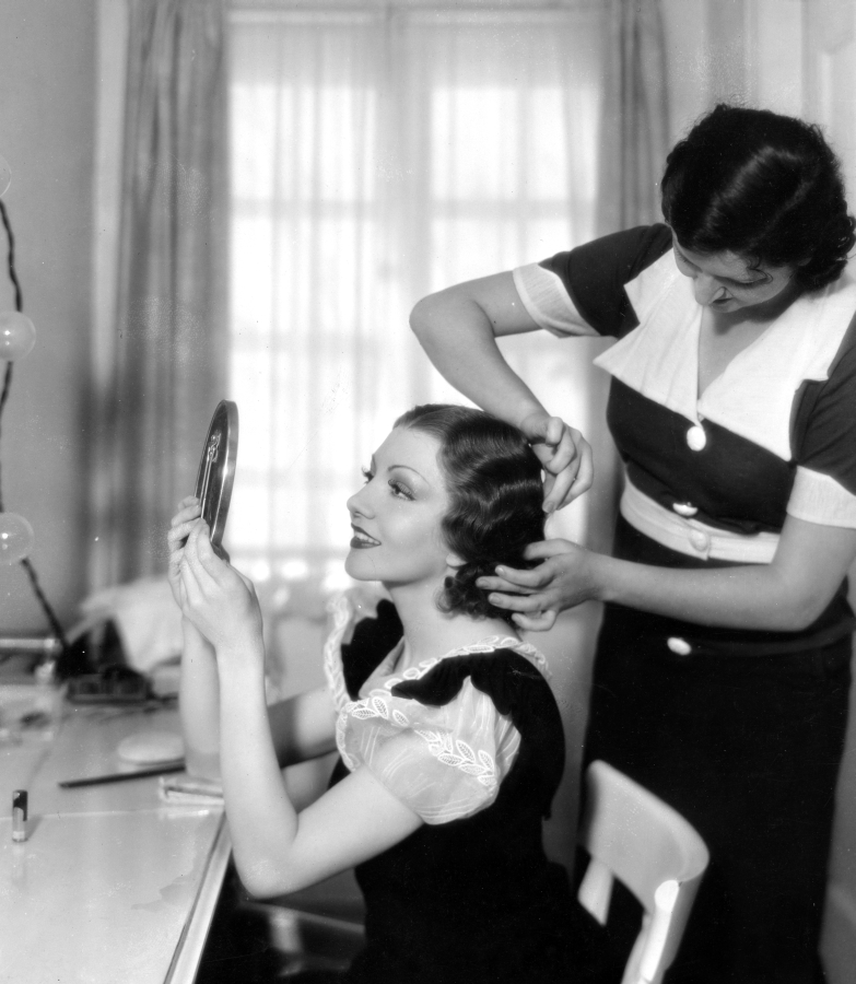 Claudette Colbert 1934 Having her hair styled in Marcel Waves by the studio hairdresser.jpg